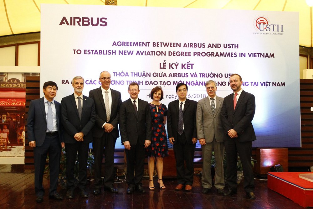 Members of Airbus and the University of Science and Technology of Hanoi mark an agreement to collaborate on new degree programmes. 