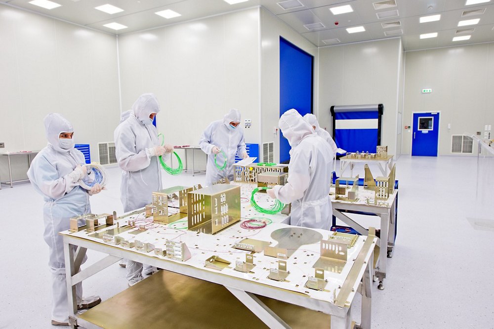 A view of workers inside Airbus’ Warsaw, Poland clean room facility used for manufacturing spaceflight components and spacecraft integration. 