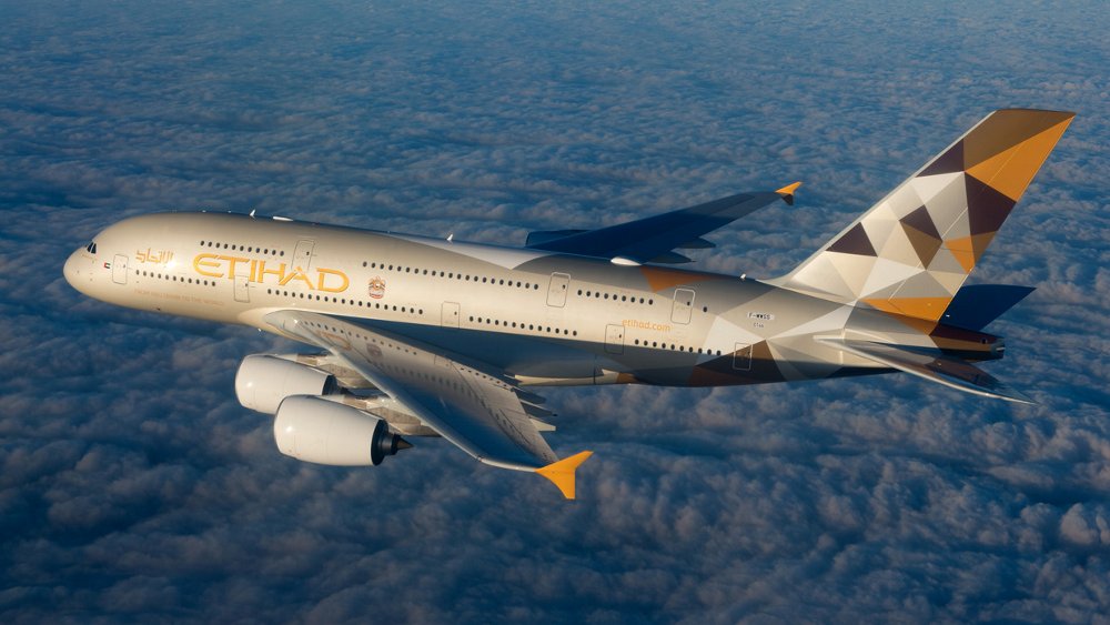 An Airbus A380 operated by United Arab Emirates-based Etihad Airways flies above clouds.  