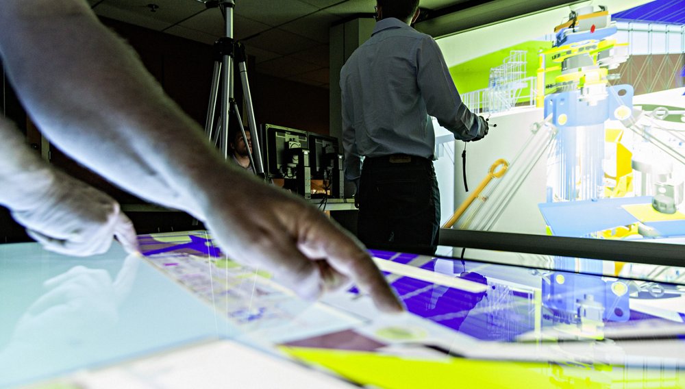 An abstract view of Airbus engineers collaborating on a design using virtual reality technology.