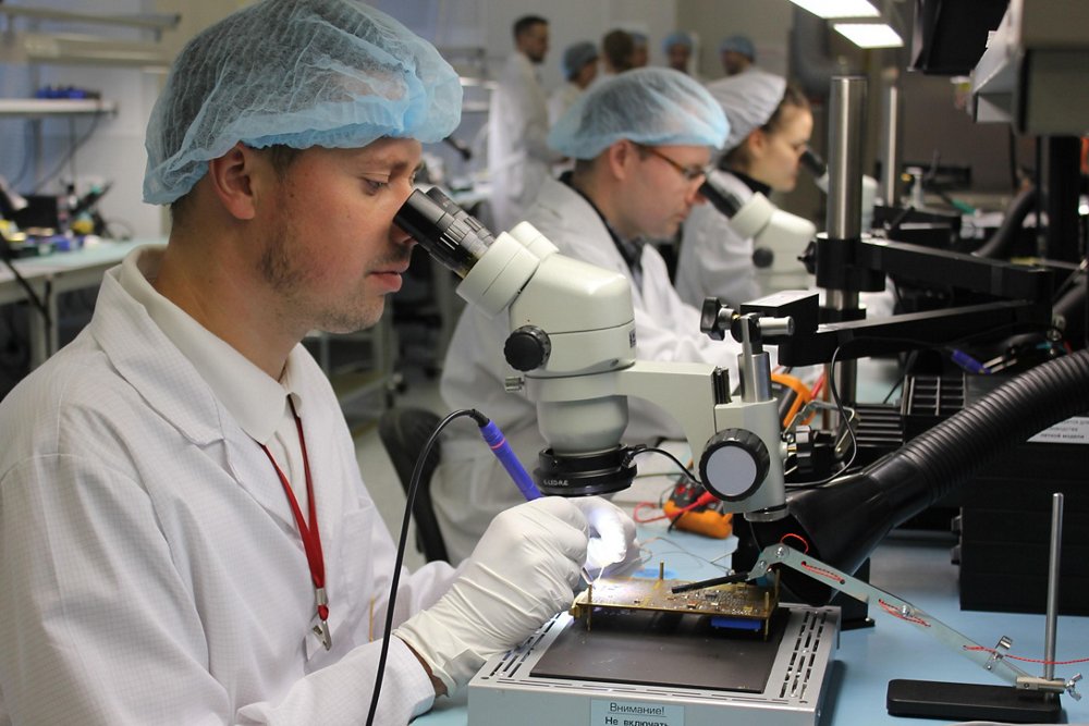 Employees from the Synertech joint venture between Airbus and Russian Space Systems work in a laboratory. 