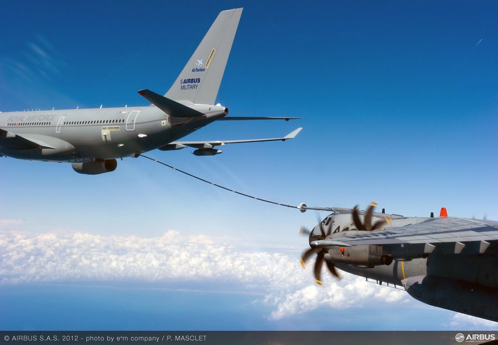 An in-flight A330 Multi Role Tanker Transport uses its Fuselage Refuelling Unit to transfer fuel to an A400M military airlifter. 