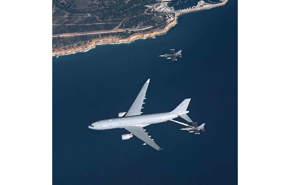 An in-flight A330 Multi Role Tanker Transport refuels a fighter aircraft using its Aerial Refuelling Boom System (ARBS).  