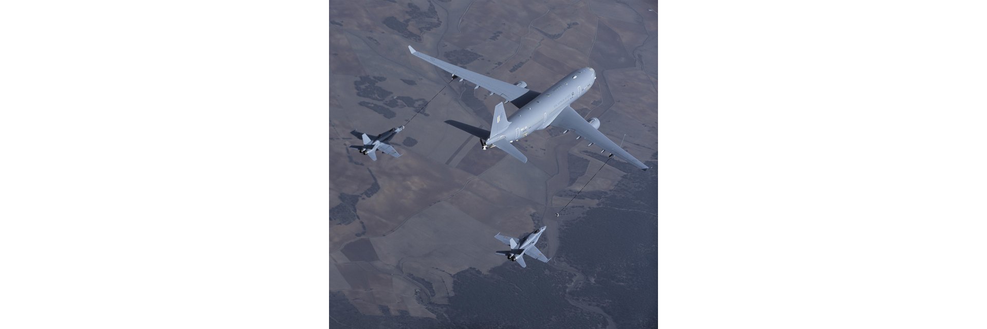An A330 Multi Role Tanker Transport performs a refuelling evaluation mission with two fighter aircraft.  