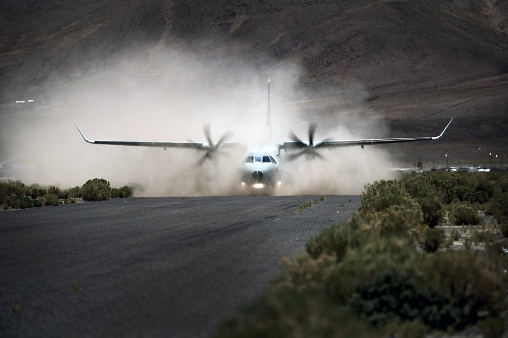 An Airbus C295 transport aircraft begins its take-off off from a semi-prepared airstrip.   