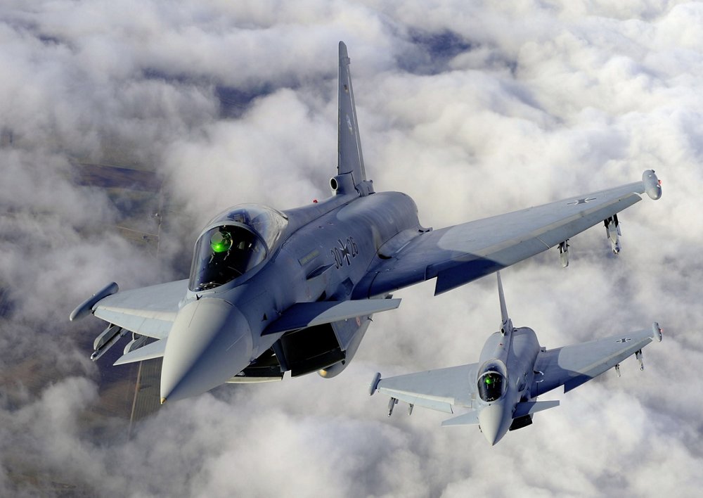 Two Eurofighter aircraft are shown flying in formation.  