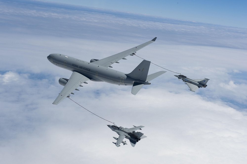 The Airbus A330 Multi Role Tanker Transport (MRTT) delivers fuel to two receiver aircraft using its hose and drogue under-wing refuelling pods. 