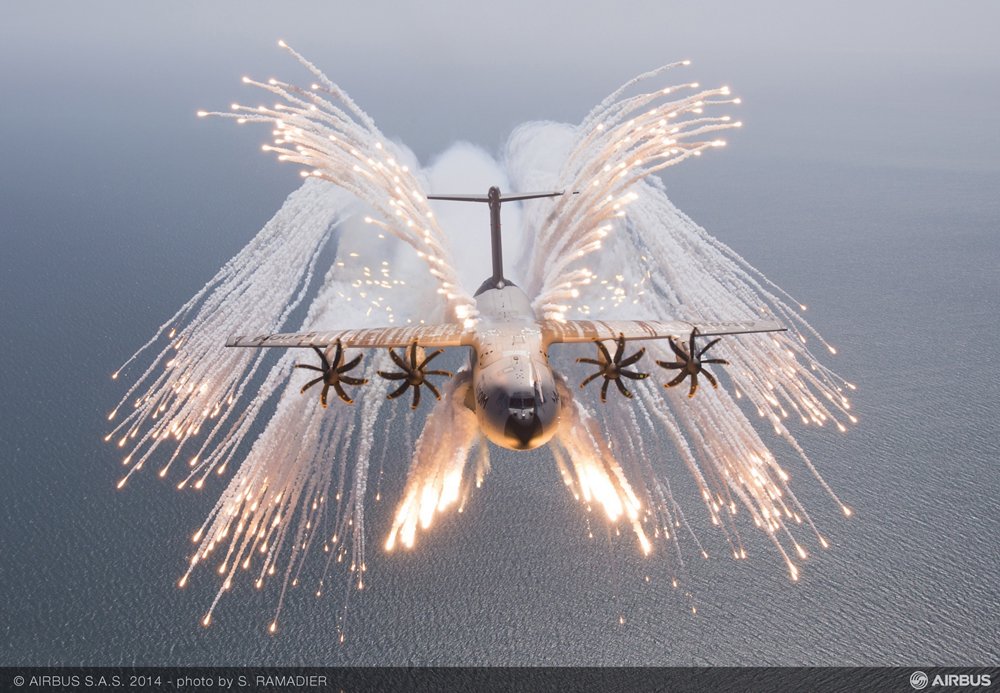 An A400M military airlifter deploys chaff and flare during an in-flight evaluation.   