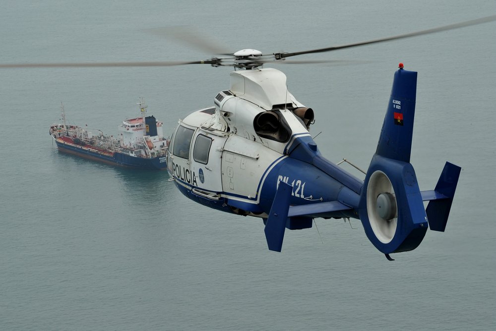 An in-flight AS365 N3+ helicopter configured for oil and gas transport services. 