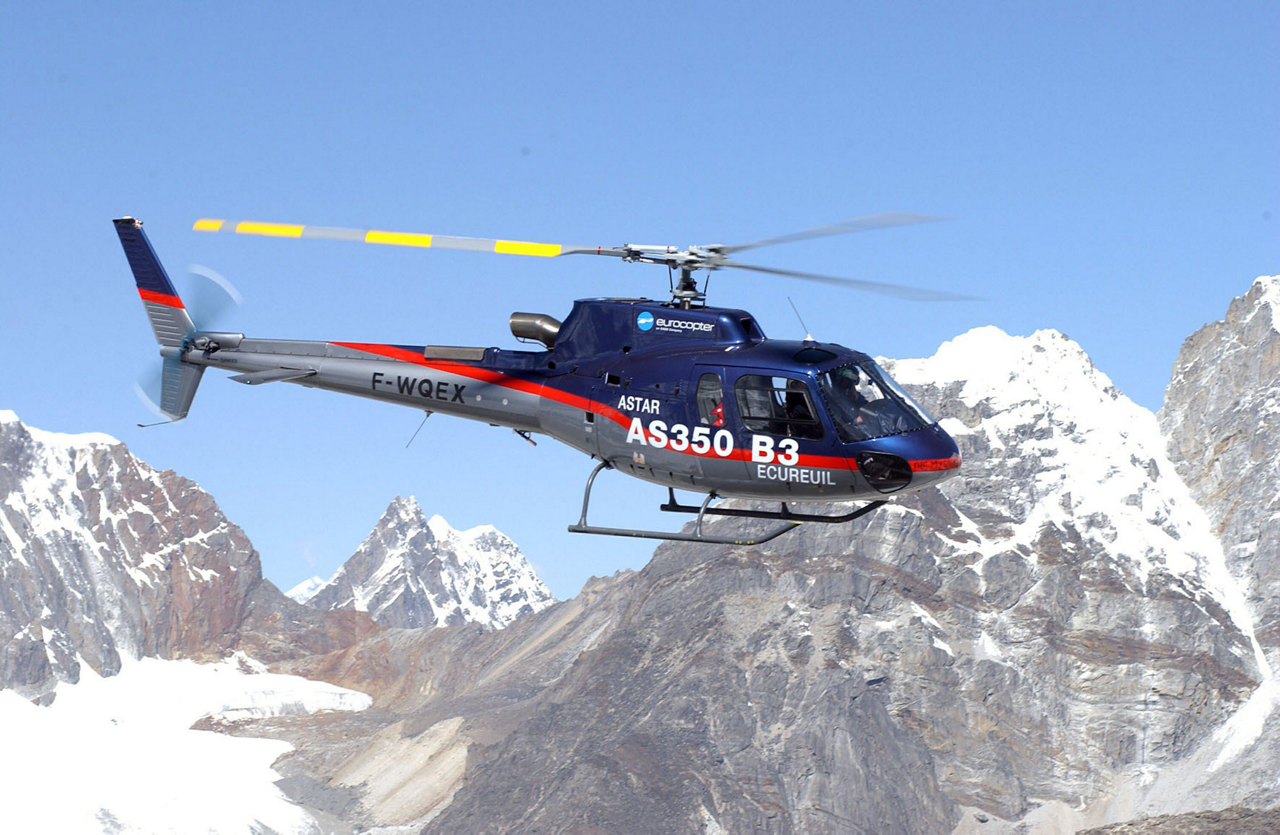 Piloted by Didier Delsalle, an Airbus AS350 helicopter (later re-designated the H125) flies over Mount Everest in 2005.  