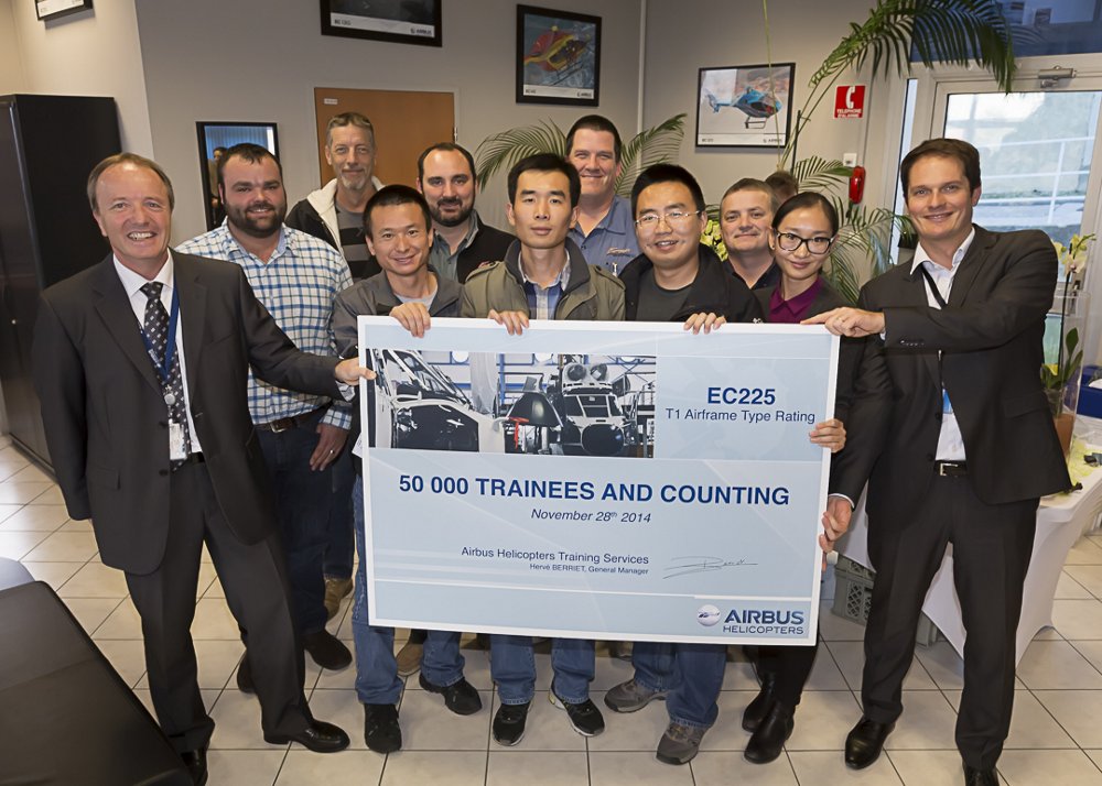 Team members from Airbus Helicopters Training Services celebrate the instruction of this operation’s 50,000th trainee overall.   