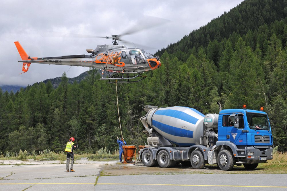 An H125 performs aerial work duties, demonstrating its multi-mission capabilities 