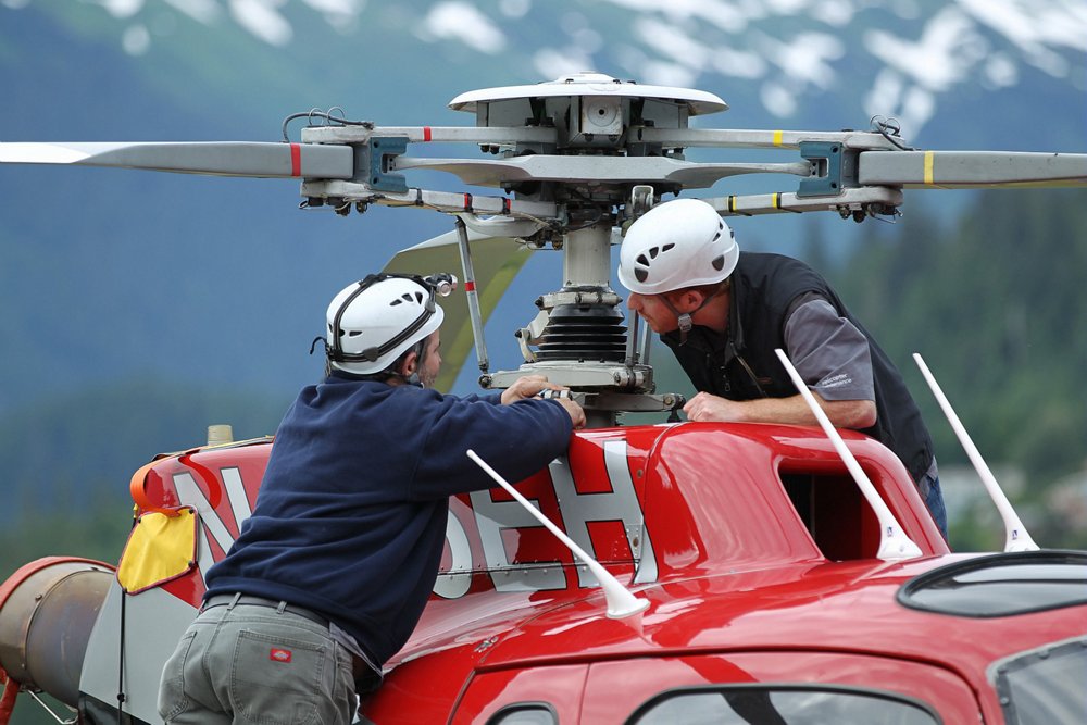 Maintenance is performed on an Airbus H125 helicopter’s main rotor system