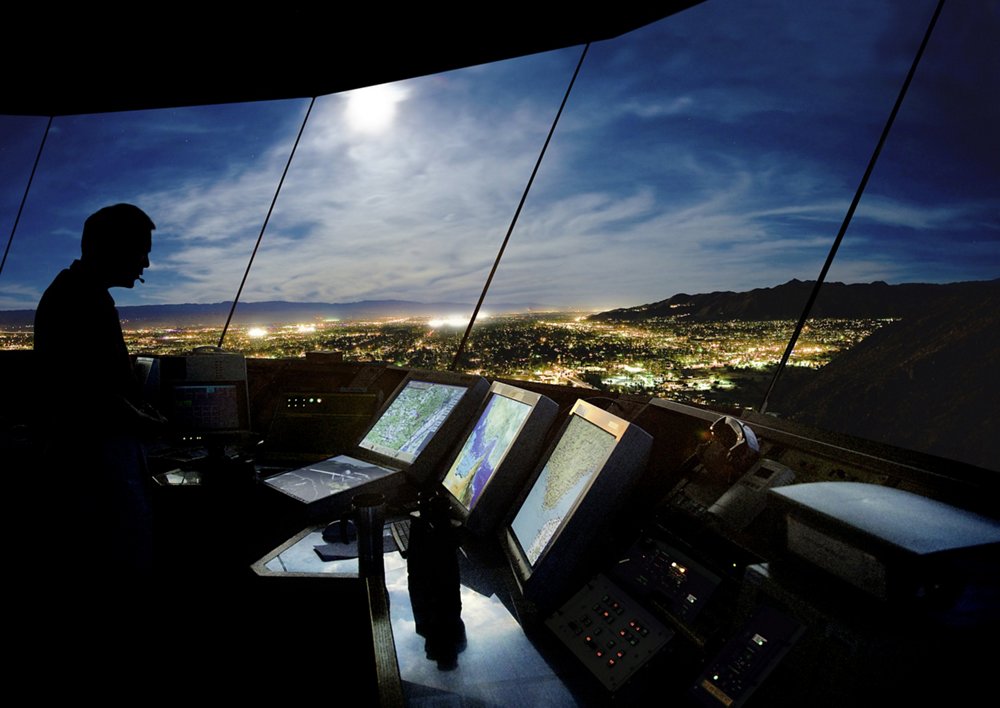 Dramatic view of a satellite ground control station at night.  