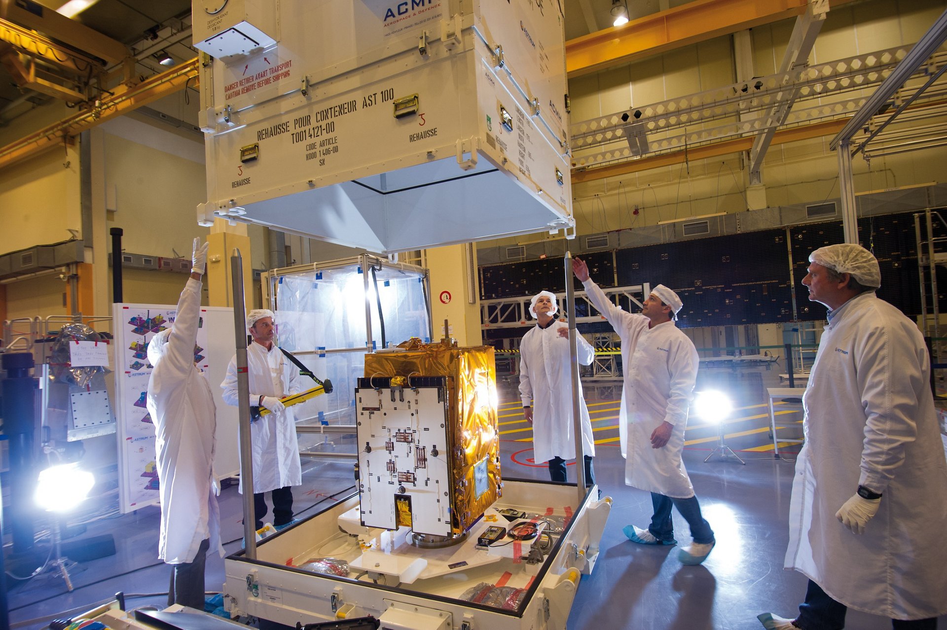 The Airbus-produced VNREDSat-1 Earth observation satellite is removed from its shipping container.  