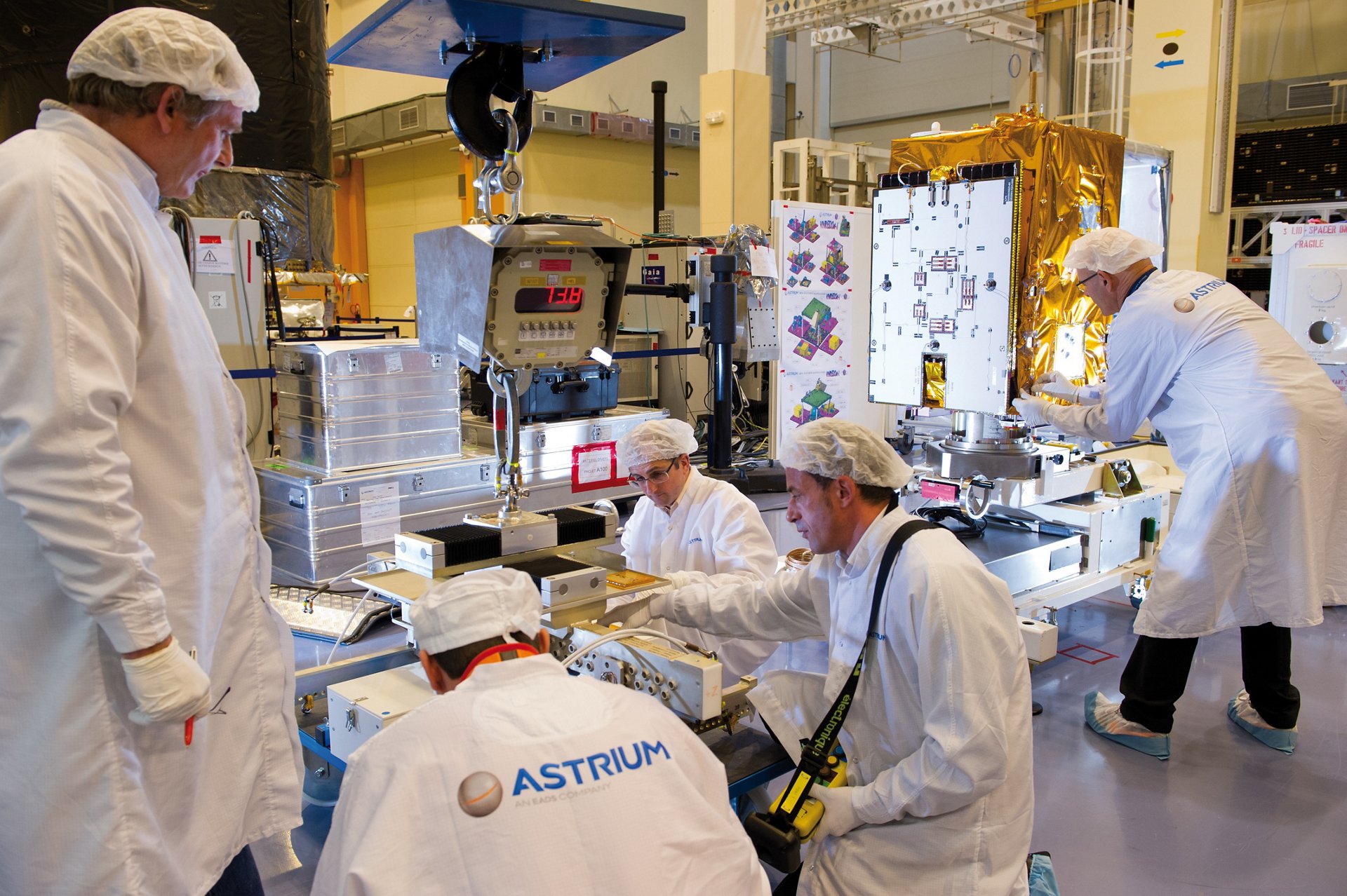 The VNREDSat-1 Earth observation satellite is readied by Airbus engineers.  