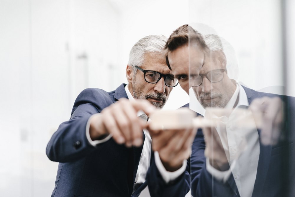 Images of people at work show them engaged with an activity, or in a professional space.