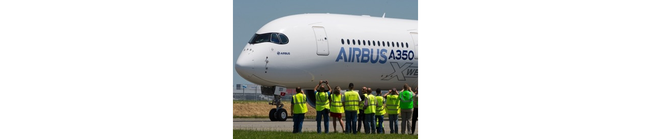 Airbus employees welcome home the no. 1 A350 XWB at the conclusion of its maiden flight.  