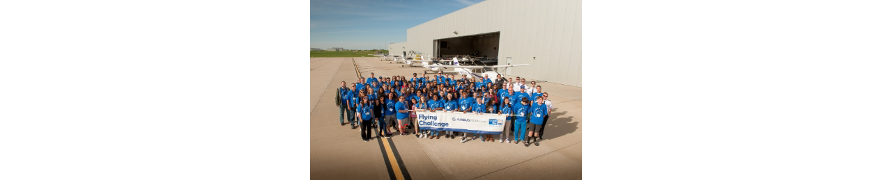 A group photo of participants at an Airbus Foundation Flying Challenge event in Getafe, Spain. 