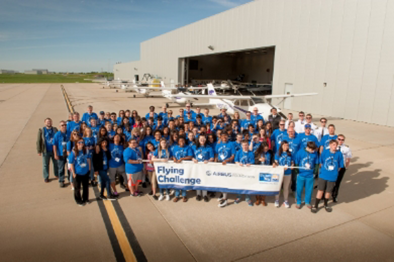 A group photo of participants at an Airbus Foundation Flying Challenge event in Getafe, Spain.