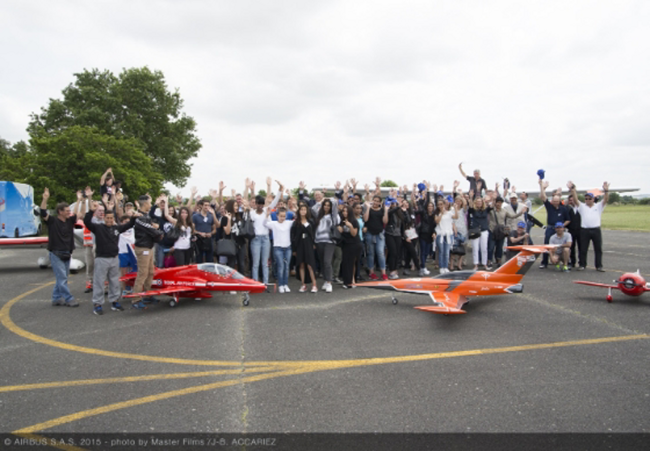 A group photo of participants at an Airbus Foundation Flying Challenge event in Toulouse, France.