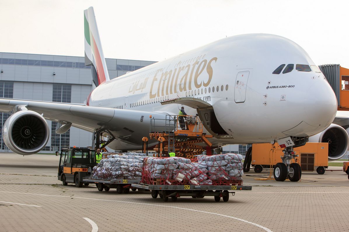 Emergency shelter items are loaded on board of an Emirates A380 flying from Hamburg to Dubai
