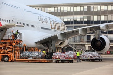 Emergency shelter items are loaded on board of an Emirates A380 flying from Hamburg to Dubai
