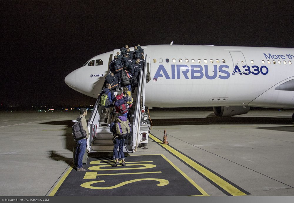 Aid workers board an A330 aircraft on their way to support Airbus Foundation-supported relief efforts.  