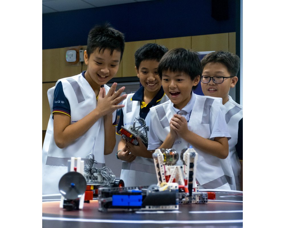 Four students build a space base model as part of the Airbus Little Engineer programme.