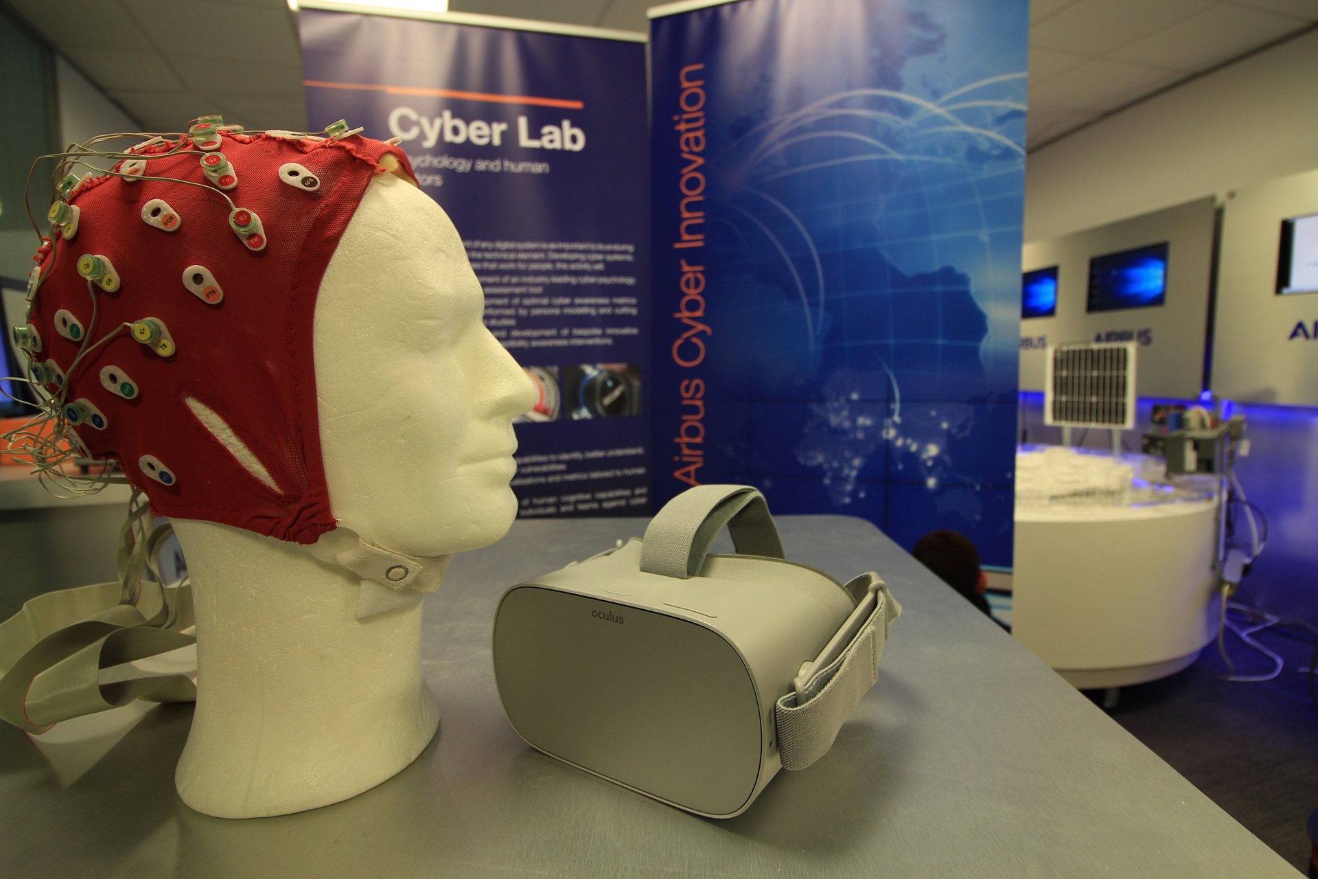 An exhibit stand promotes technologies related to CyberLab, a major security research initiative jointly funded by the Welsh government and Airbus.  