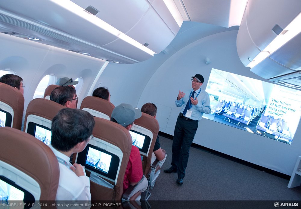 The Airbus Comfort Zone’s full-scale cabin mockup is shown at the 2014 Singapore, Airshow during a briefing for attendees on the company’s standard 18-inch wide economy class seats. 