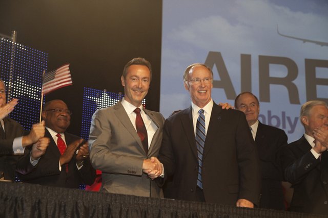 Airbus President & CEO Fabrice Brégier (at left) and Alabama Governor Robert Bentley pose for international journalists during the 2 July 2012 event announcing the new A320 Family jetliner production facility in Mobile, Alabama