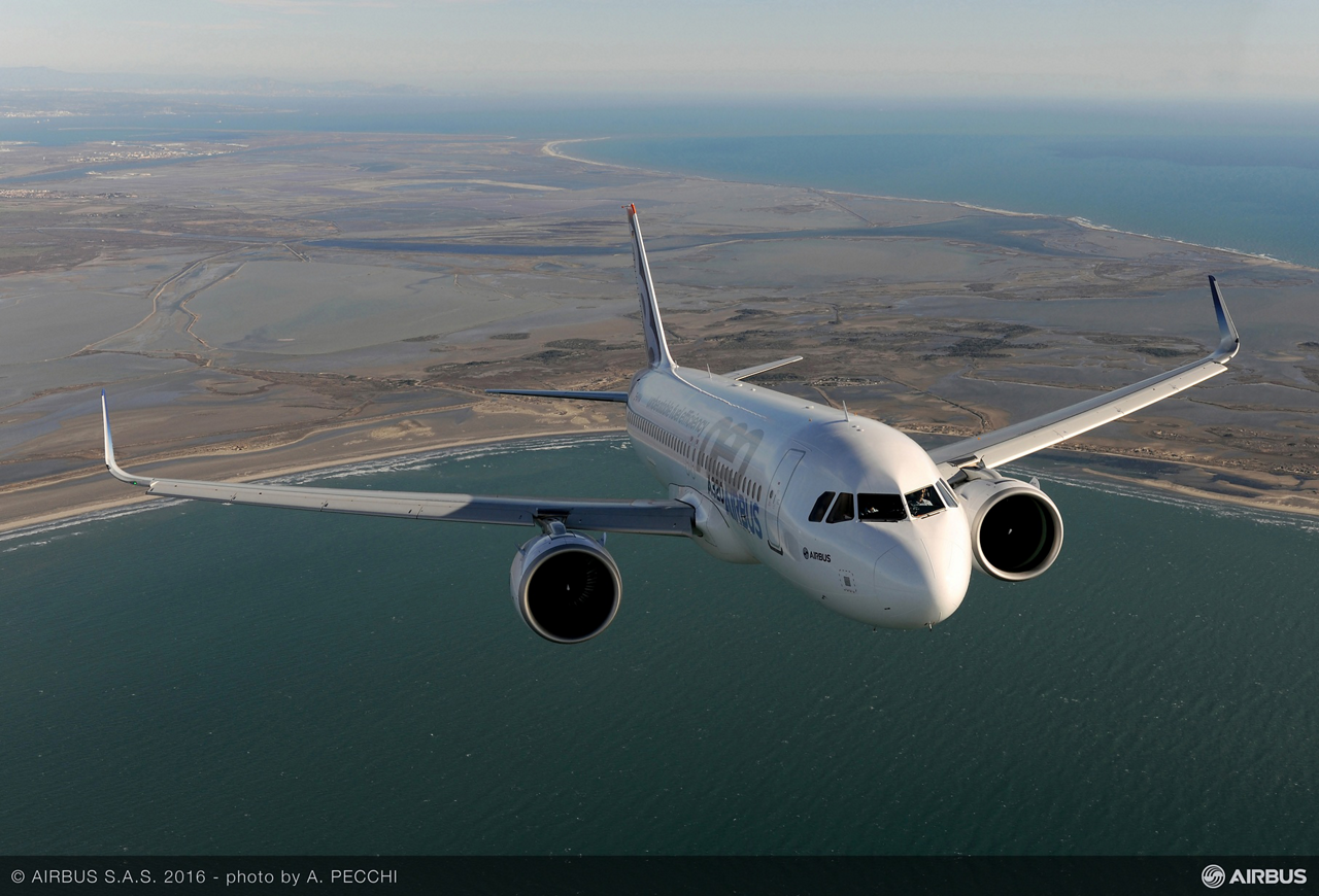 An Airbus A320neo commercial aircraft is shown in flight.  