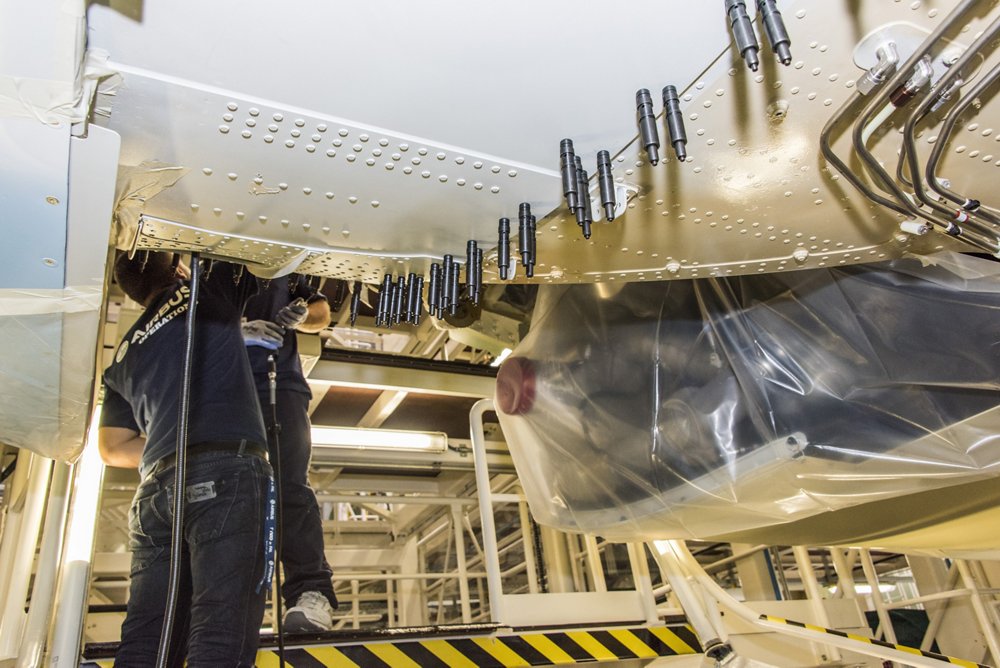 Production employees work on an A320 Family aircraft at the Airbus U.S. Manufacturing Facility in Mobile, Alabama. 