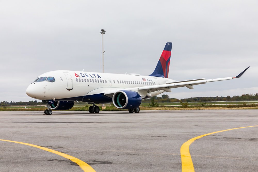 An on-ground view of an A220 commercial aircraft in the livery of U.S. operator Delta Air Lines.   