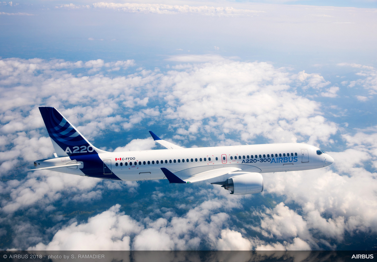 Side view of an in-flight Airbus A220-300 version.   