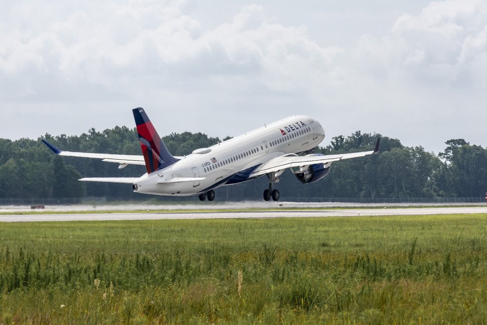 The first Airbus A220 assembled in the U.S., received by Delta Air Lines, is shown during take-off.