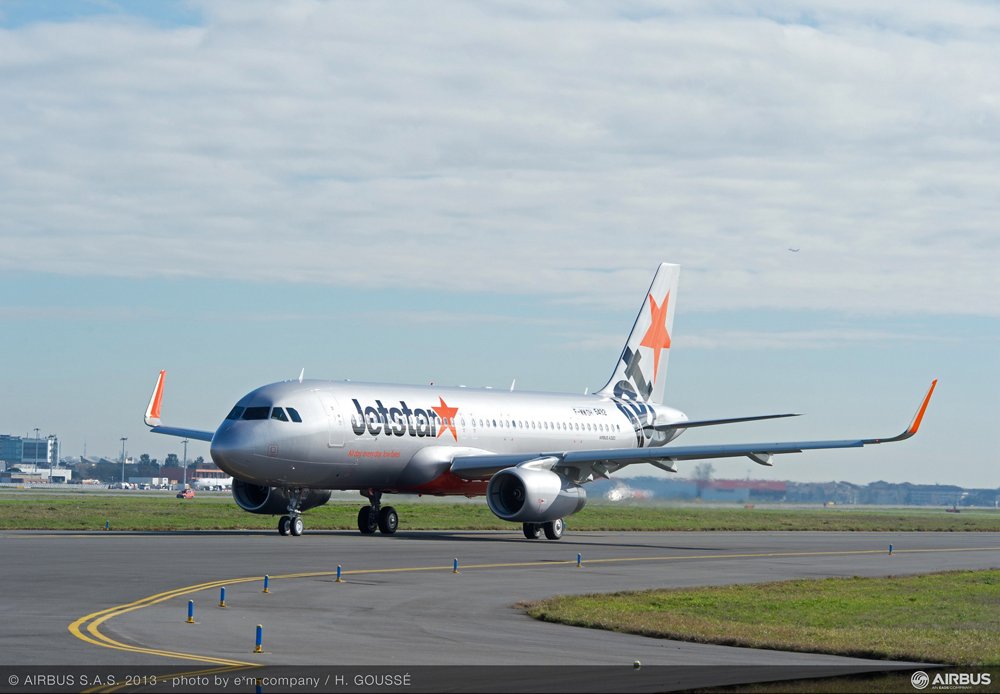 An A320 delivered to Jetstar Pacific taxis at an airport. 