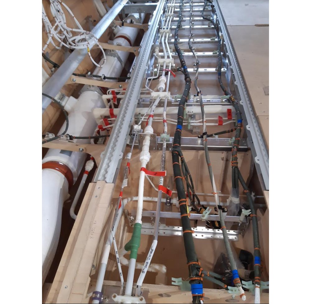 One of the early wooden mockups was used to verify the accessibility and installation of the electrical and mechanical systems installation, including the air conditioning piping, hydraulic piping, bleed air piping and fuel lines.