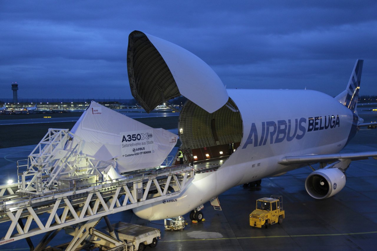 An Airbus A300-600ST Beluga oversize airlifter transports the vertical tail plane for Qatar Airways’ first A350-900 jetliner from Stade, Germany to the A350 XWB final assembly line in Toulouse, France