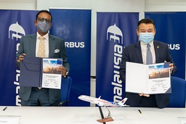 Airbus President Asia Pacific Anand Stanley & Malaysia Airlines Chief Operations Officer Ahmad Luqman Mohd Azmi Signing The Extended Widebody FHS Agreement