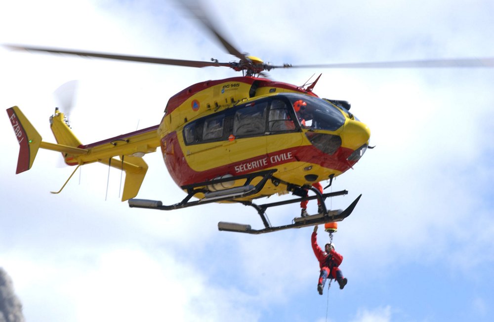 Team members are lowered to the ground by an in-flight EC145 helicopter delivered to the French Sécurité Civile agency.  