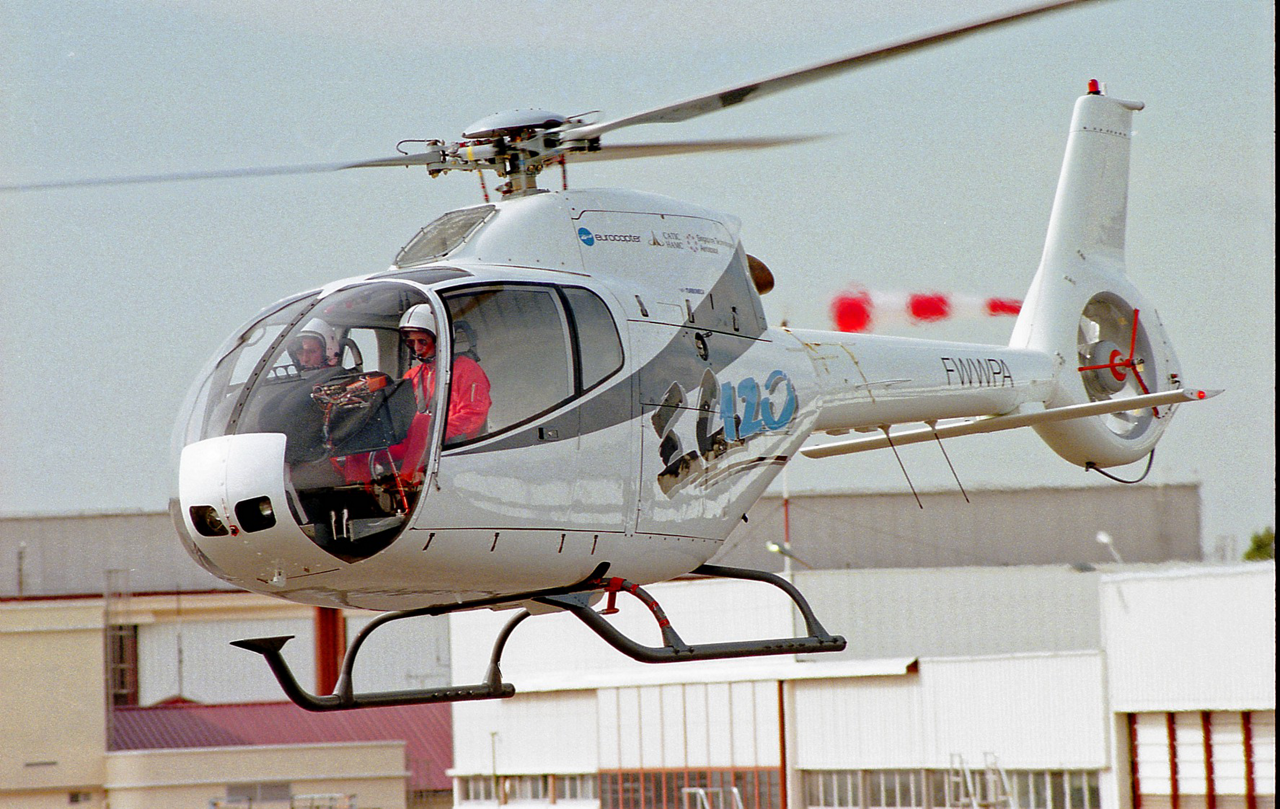 The EC120 Colibri is shown during its 1995 maiden flight, with a view of the two pilots inside the cockpit.