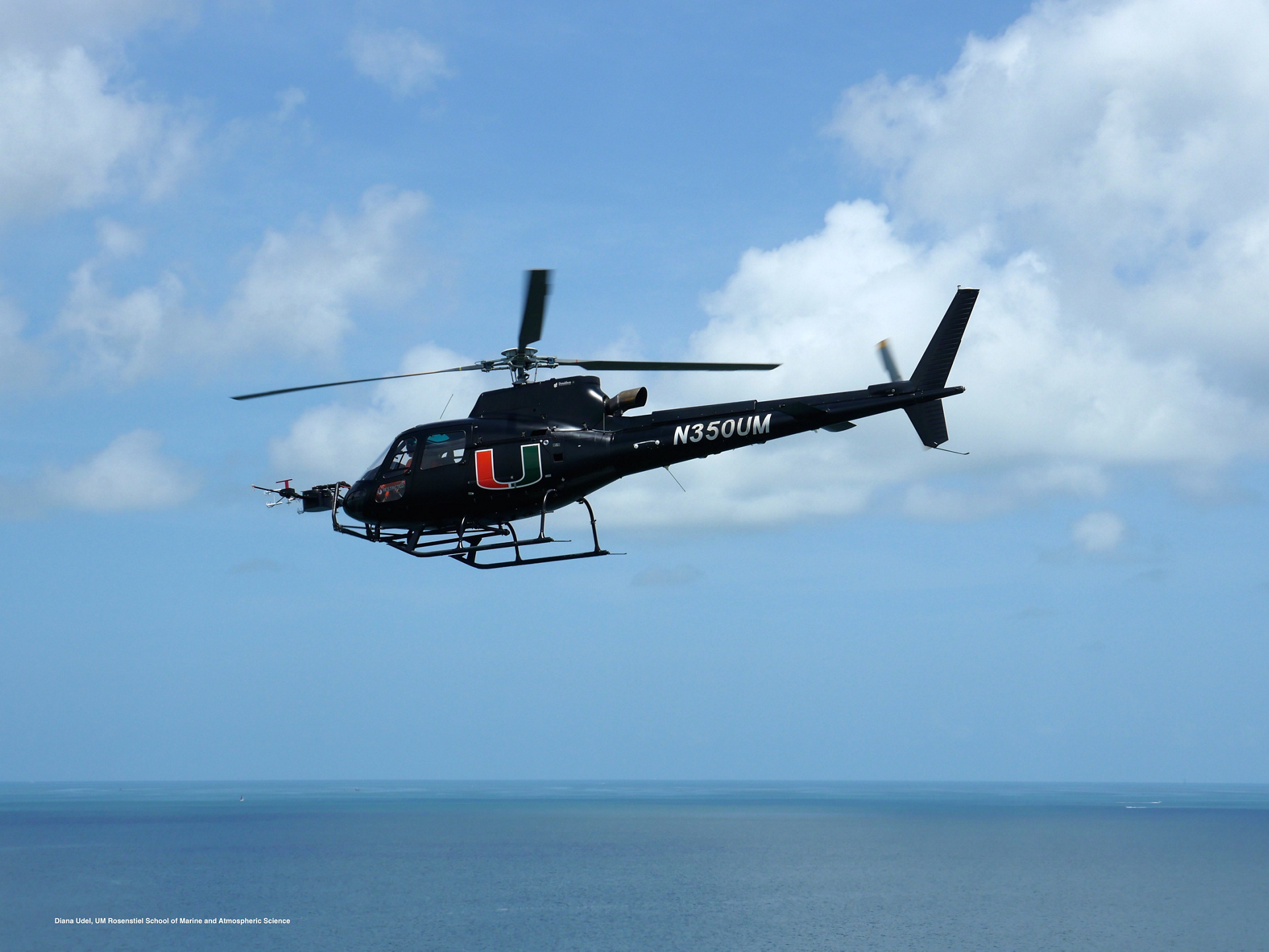 An NH90 helicopter is shown inside a maintenance facility, ready for servicing.