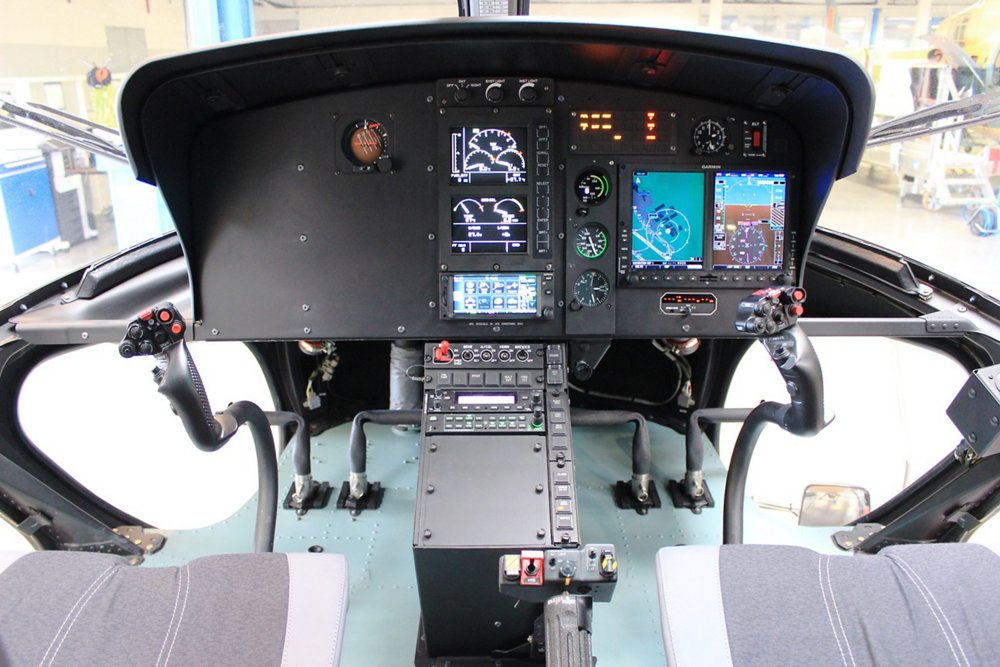 A close-up view of the H125 helicopter’s glass touchscreen cockpit instrument panel 