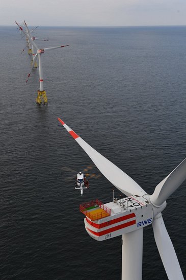 Wiking Helikopter's H145 desceding upon wind turbine 