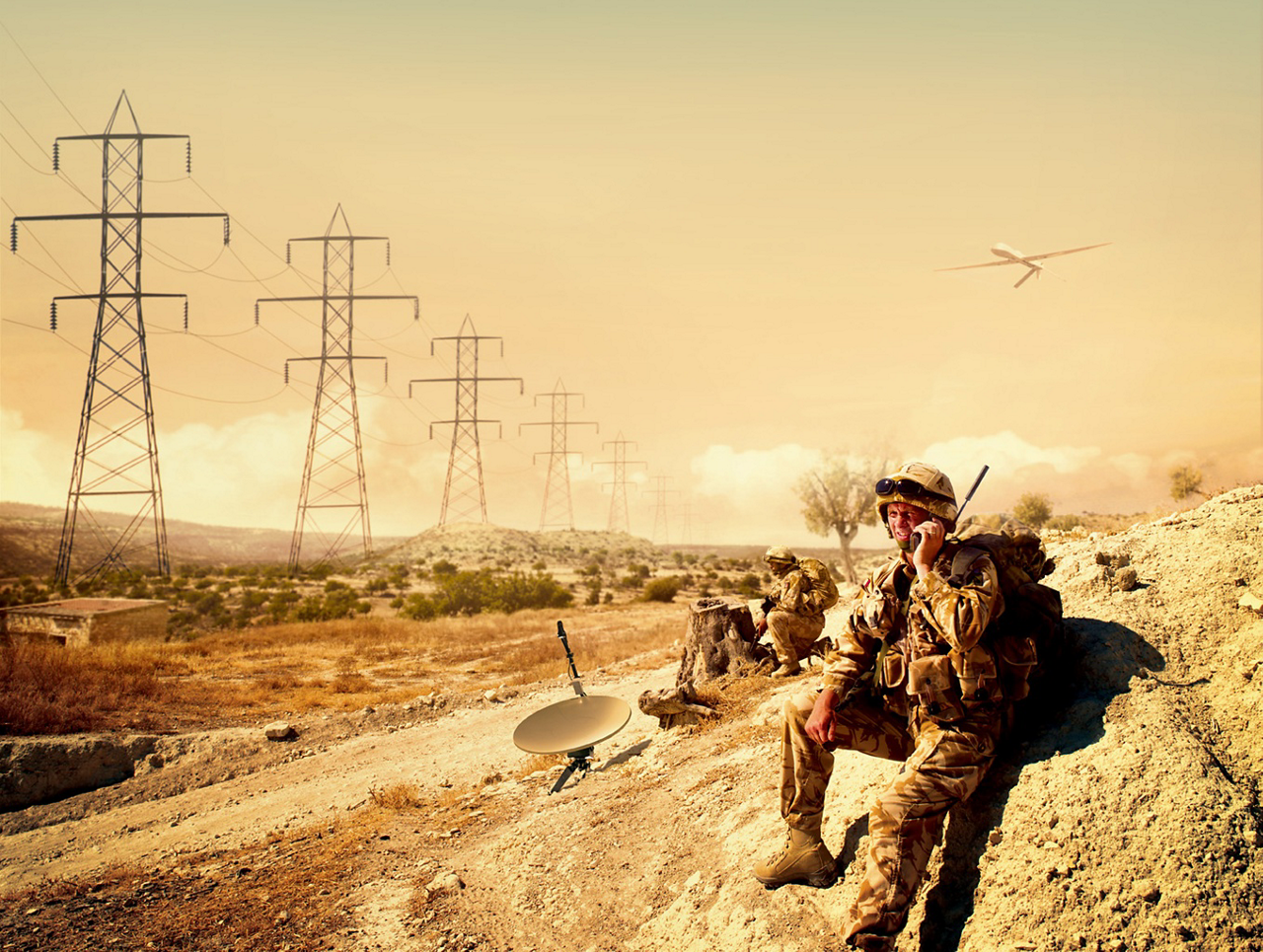 A soldier speaks into a communications handset.   
