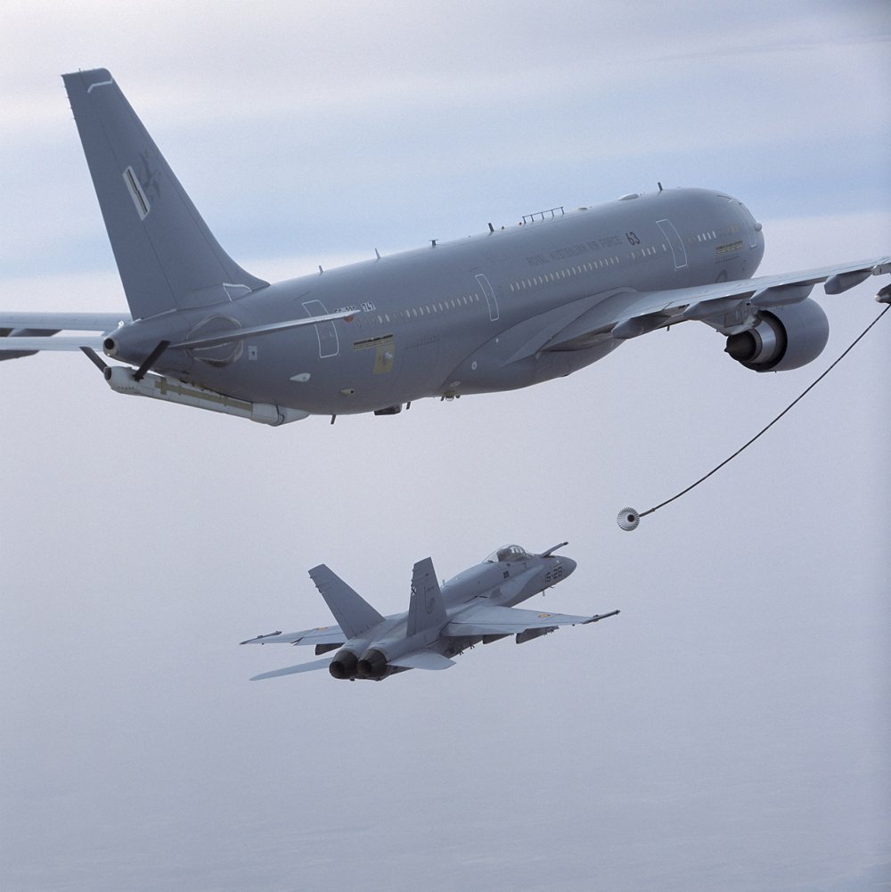 An Airbus A330 Multi Role Tanker Transport (MRTT) with its hose and drogue system deployed for aerial refuelling. 