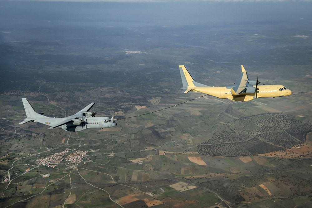  Two Airbus C295 transport aircraft are shown during air-to-air refuelling evaluations.  
