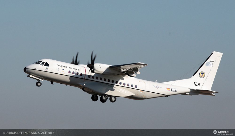 Side view of an in-flight C295 tactical aircraft delivered to the Philippine Air Force. 